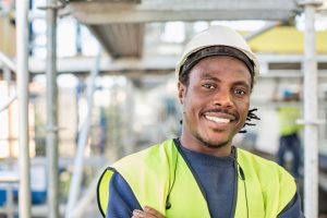 Portrait of happy construction worker at site